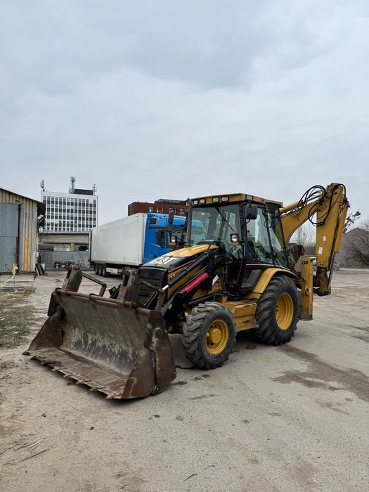 Caterpillar 428D  w komplecie widły, 3 łyżki tylne
