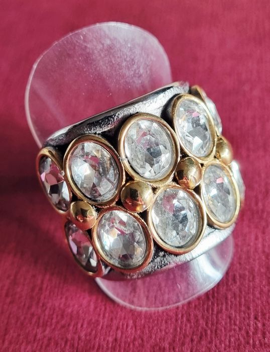 Anel bicolor, em aço, com 10 pontos de luz ovais.  T20