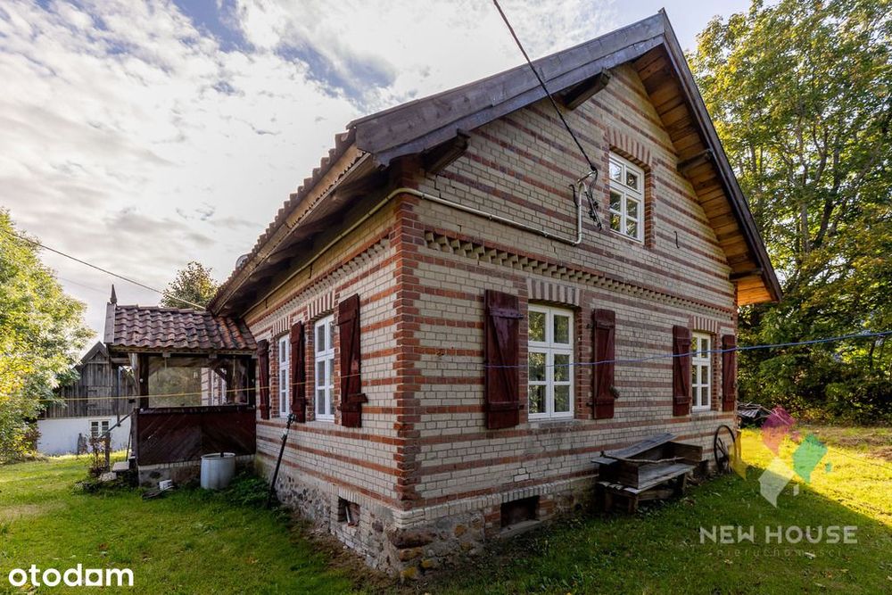 Dom wolnostojący w stylu warmińskim, las, jezioro