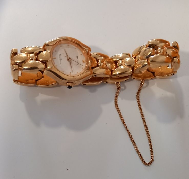 Relogio Oriente dourado