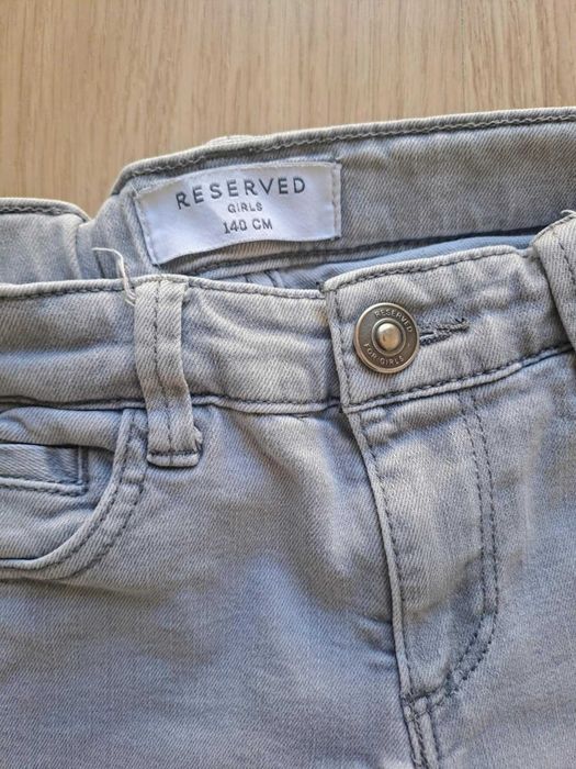 Zestaw tregginsów jeansowych dziewczęcych DKNY i RESERVED na 140 cm