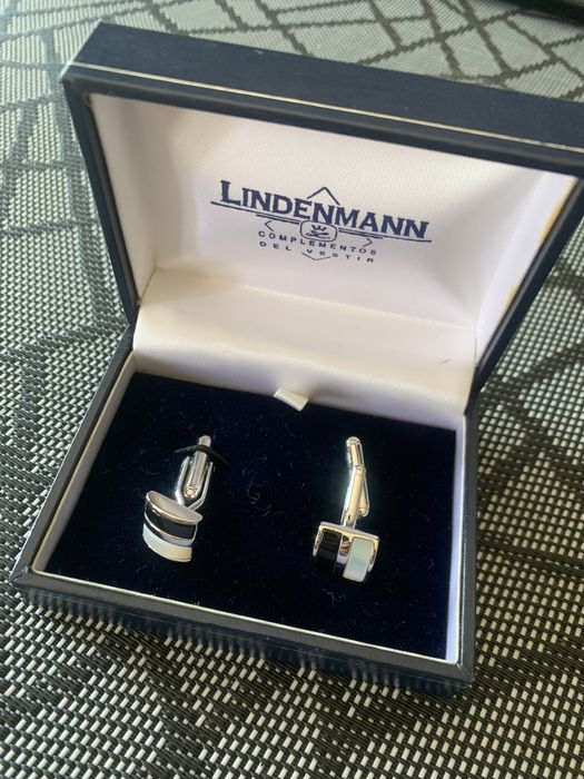 Botões de punho como Novos