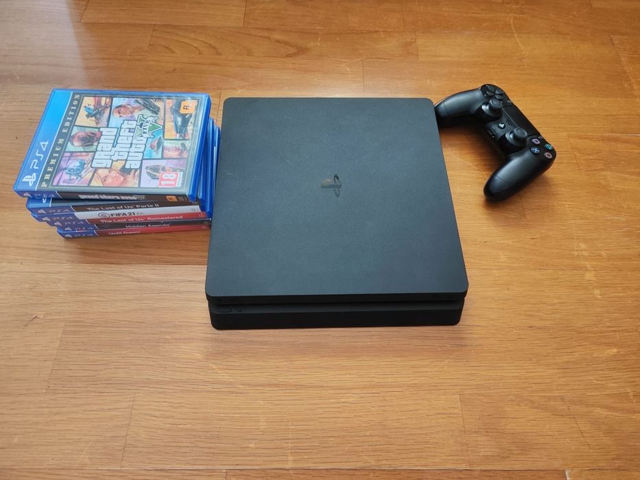 PS4 com jogos e cabos