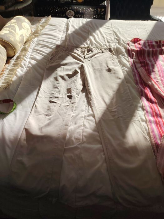 Calças cremes Lion Porsches