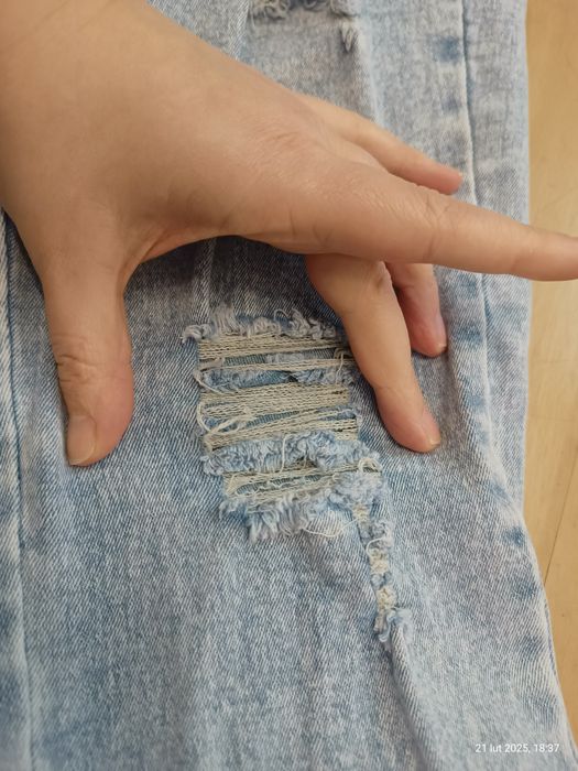 Spodnie dzwony z dziurami rozciągliwe dla dziewczynki rozm. 150