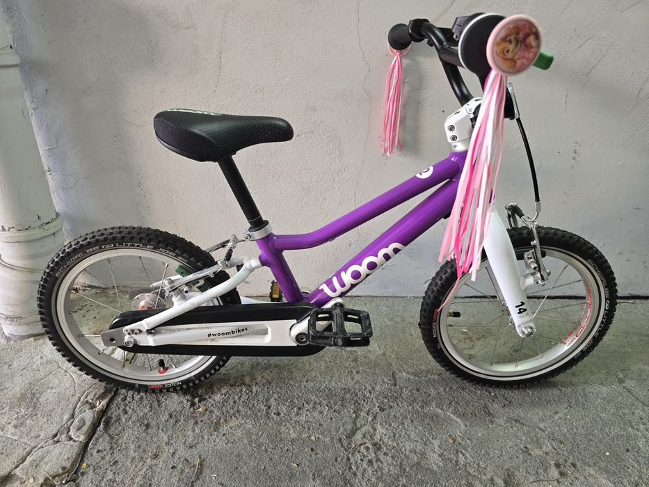 Woom 2 fioletowy z kaskiem i adapterami