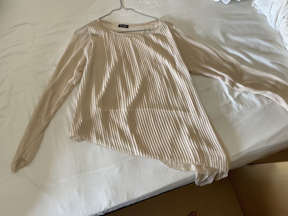 Blusa assimetrica plissada