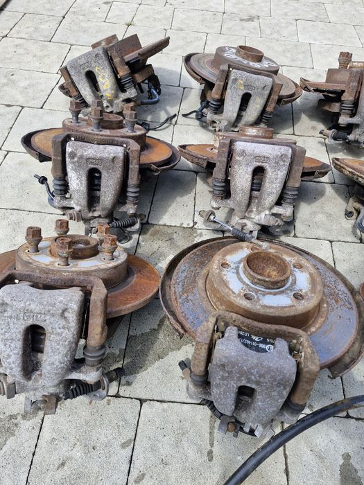 супорт задній диск тормозний Opel Astra H Zafira B