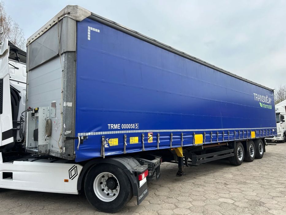 Schmitz Cargobull FIRANKA PODNOSZONY DACH NOWE PLANDEKI / 657 841 KM PRZEBIEGU / BARDZO ŁADNE OPONY / Z PEŁNYM WYPOSAŻENIEM DO ZAŁADUNKU / UCHWYTY PROMOWE / DOSTĘPNE 20 SZTUK KOLORY SREBRNY - NIEBIESKI - CZERWONY !!  20 SZTUK Przystosowana też do przewozu