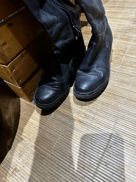 Botas cano alto em pele Fly London