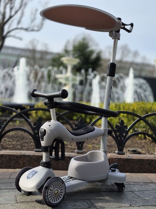 Стильний та модний самокат трансформер з батьківськой руч