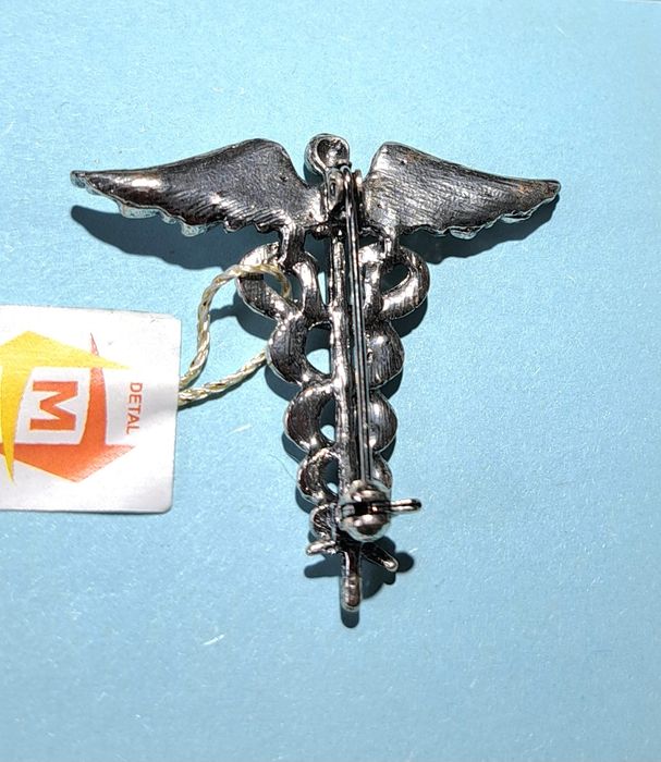 Broszka metalowa eskulap