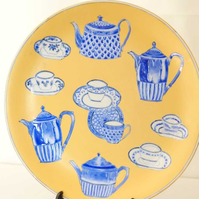 Decorative Oriental Plate Featuring Various Ceramic Motifs426580590461593601