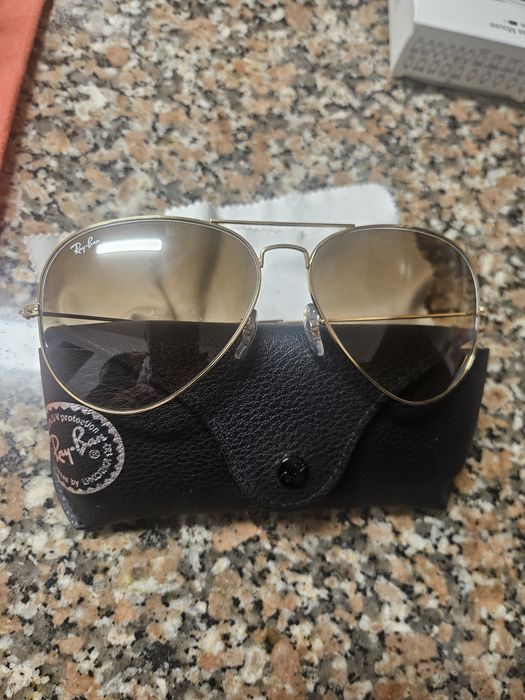 Óculos ray ban dourado