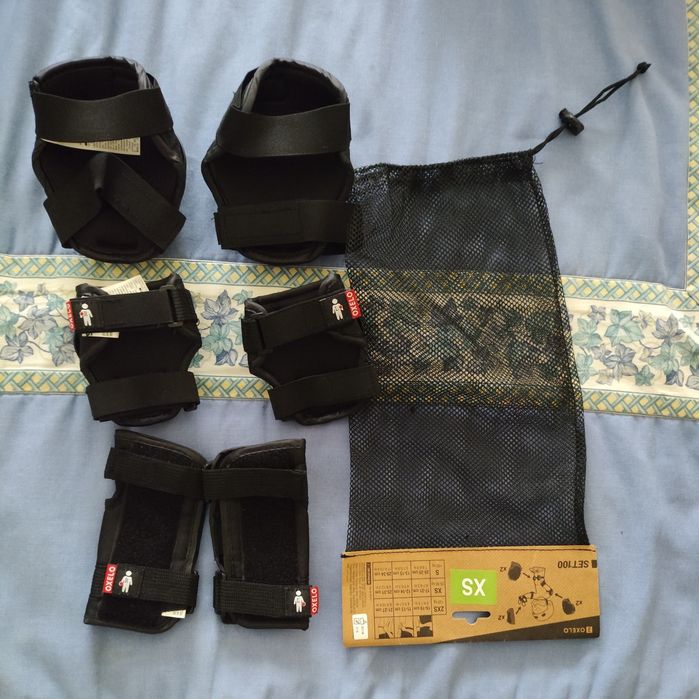 Conjunto proteções Oxelo pretas tamanho XS