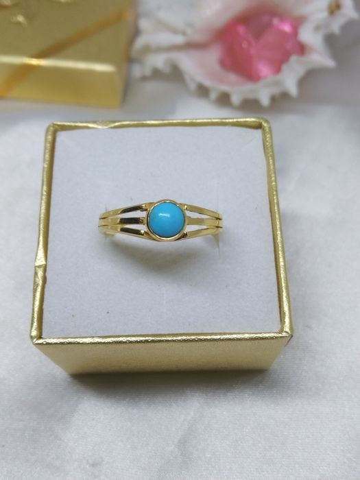 Piękny złoty pierścionek niebieskie oczko, złoto 333, r. 14