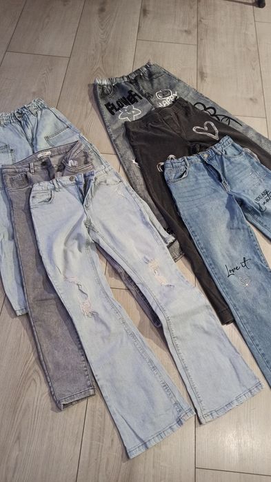 Spodnie jeansy 40 zł para 152