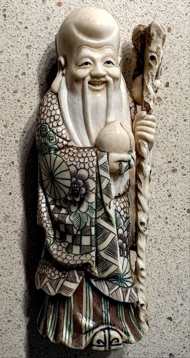 Precious antique Asian figure of a Wise Man, carved and signed