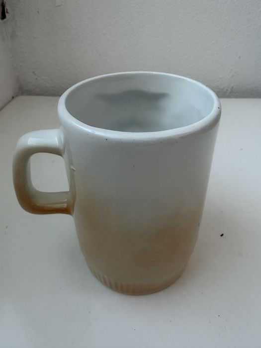 This mug is a retro ceramic cat-shaped mug.446601482784614402