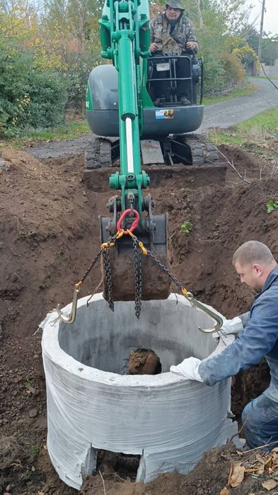 Услуги экскаватора с функцией крана. Работаем как и по городу так и за городом