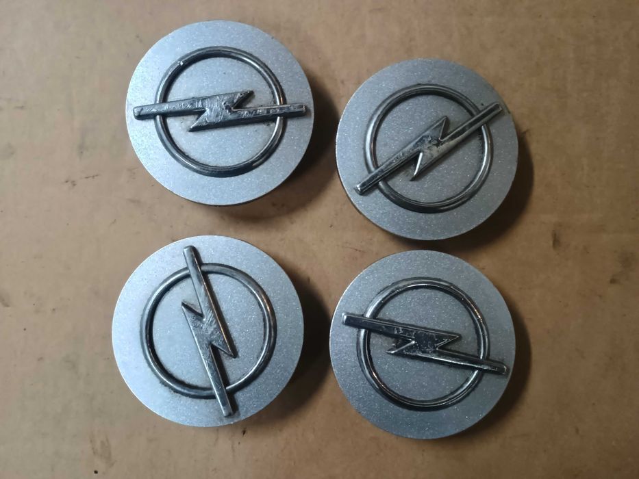 Kołpaczki dekielki felg Opel 60 mm komplet 4 sztuki