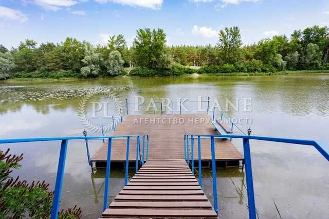 Казкове шале в Лебедівці, ділянка 1,4 га з виходом на воду.