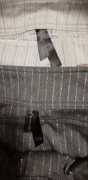 Calças tecido, cinza, 38, Stradivarius, usadas 

As calças não são elá