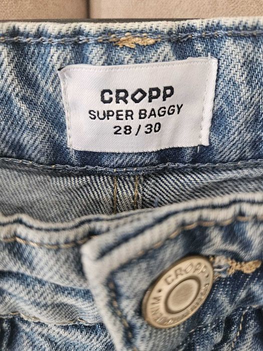 Spodnie jeansowe CROPP Super Baggy jasnoniebieskie przecierane roz 28/30