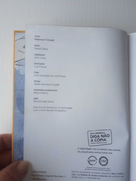 Livro  "Robinson Crusoé", de Daniel Defoe, adaptação de John Lang
