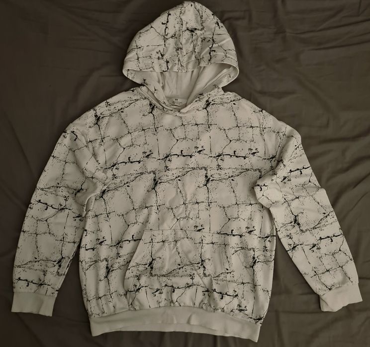 Sweatshirt branca com um design interes da H&Msante.