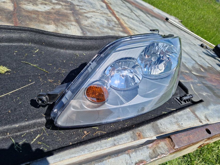 VW Golf + PLUS reflektor HELLA NOWY ORG