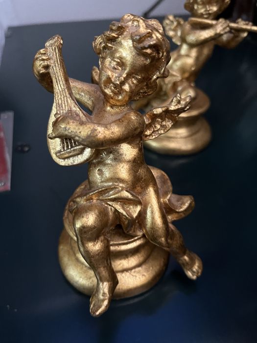 Quatro estatuetas64752093780481124