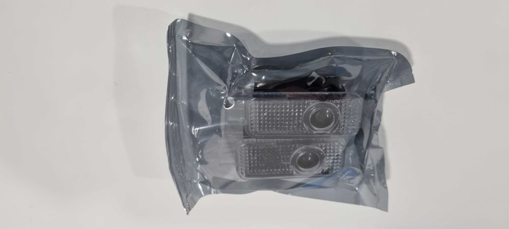 Luz boas vindas portas Audi
