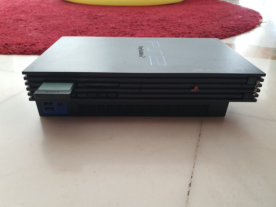 Playstation 2 + Buzz + comados.