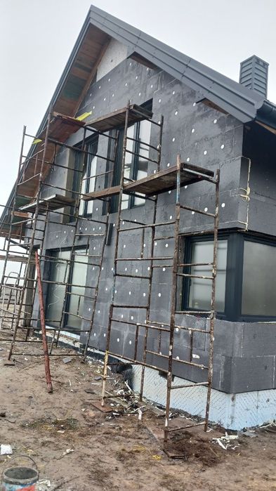 Ocieplenia, malowanie elewacji, klejenie  papy  termozgrzewalnej  Woln