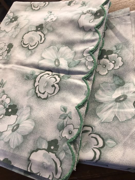 Green and White Bed Sheets with Cut-Out Designs