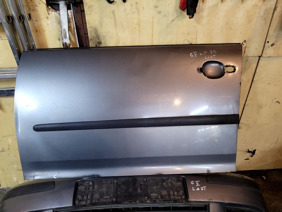Drzwi lewe przód przednie poszycie vw golf V 03- kod lakieru LA7T 5d