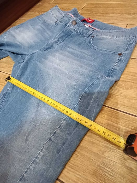 Spodnie 7/8 jeansy damskie niebieskie 44