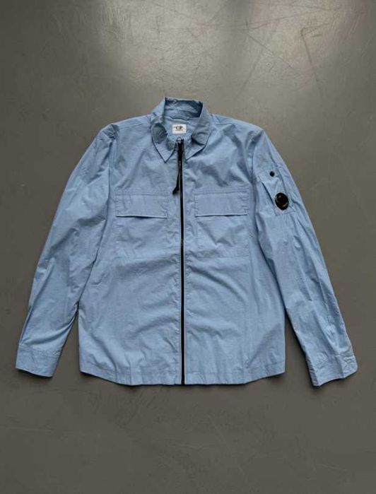 Вітровка CP Company блакитна на весну з круглою лінзою