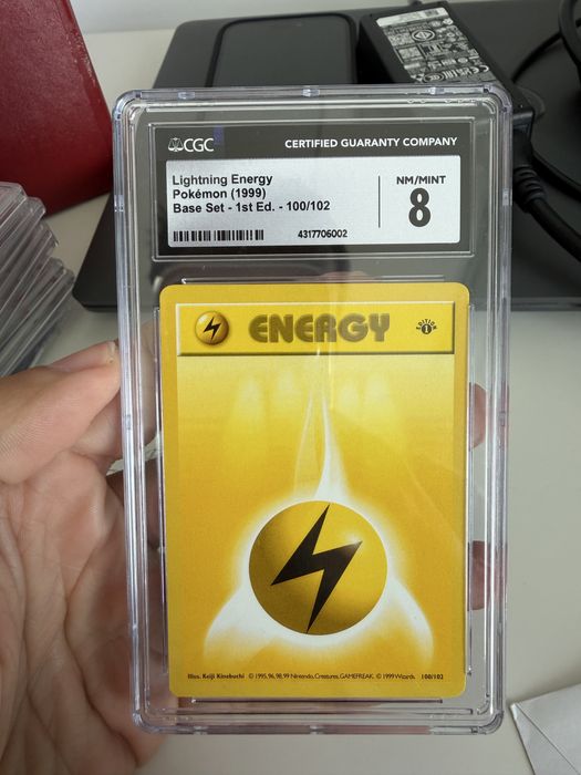 Carta pokemon graded lightning energy 1st edition base set