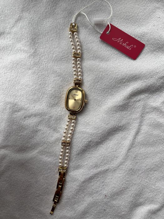 Золотий годинник з перлами