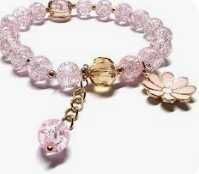 Браслет із рожевими намистинами та підвіскою-квіткою