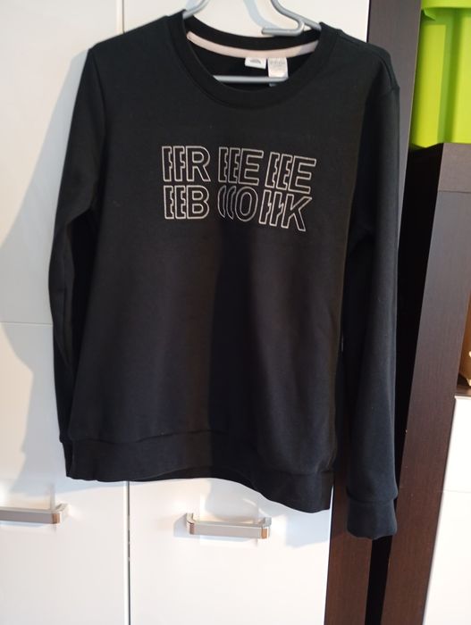 Czarny sweter męski.Reebok