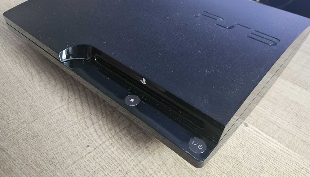 Sony PS3 Slim CECH-2004A 120GB + oryginalny DualShock 3 + 2 gry