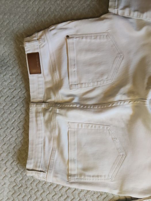Białe jeansy damskie Orsay rozmiar 38