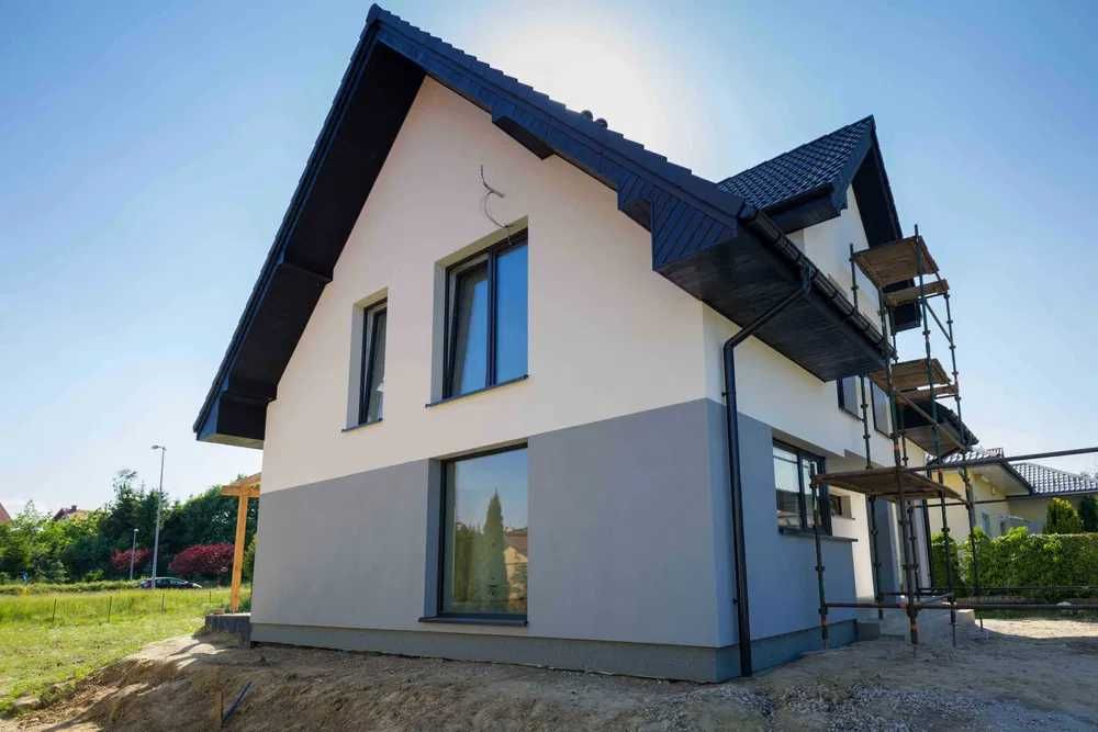 Мурування стін. Будівельні роботи. Кладка цегли, блоків. Фасад