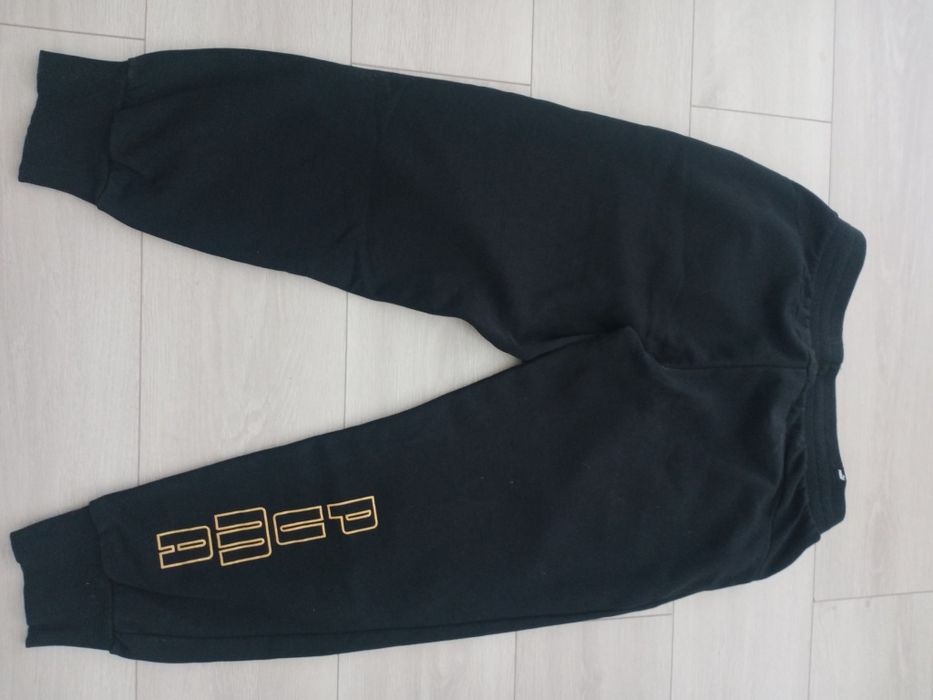 Spodnie PUMA złote napisy r. M