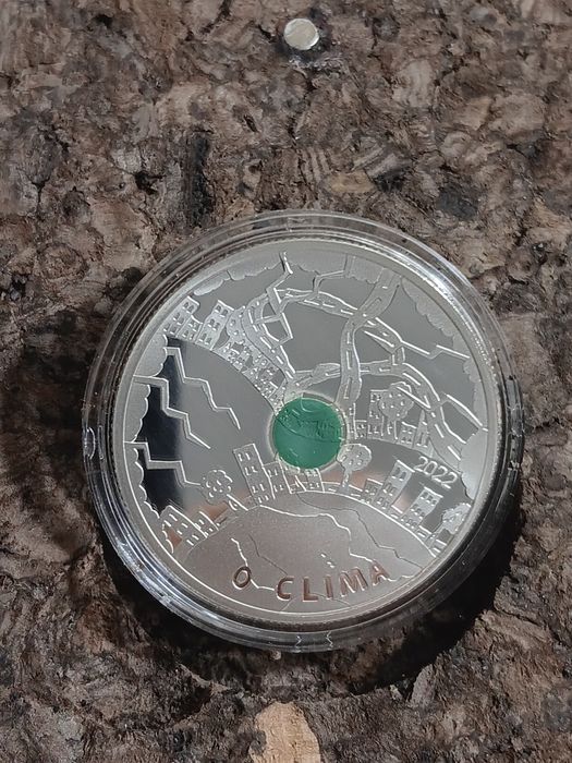3 moedas prata prof de 5€ . O  Clima