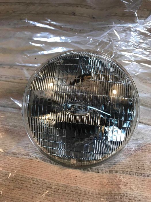 Ótica farol dianteiro original marca Koito