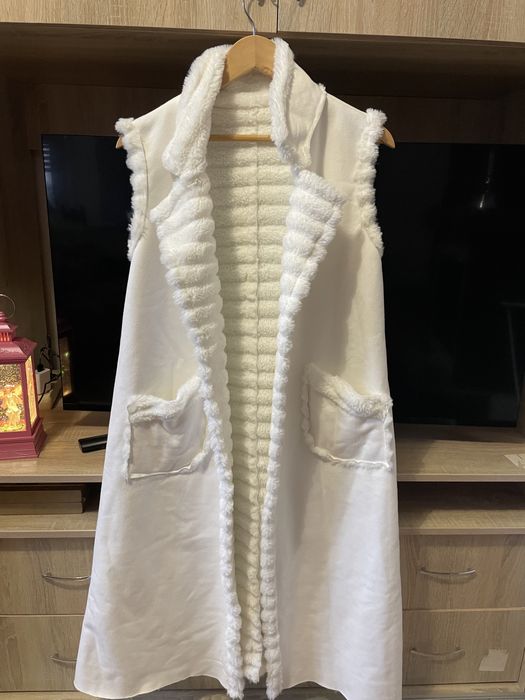 Продам теплу жилетку